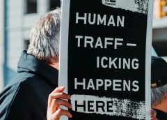 Sign that says "Human trafficking happens here"