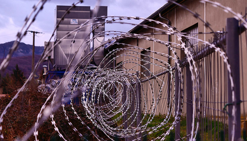 Close-up of barbed wire at a prison