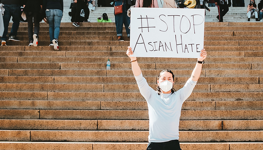 Person with "stop Asian Hate" sign on Capitol steps