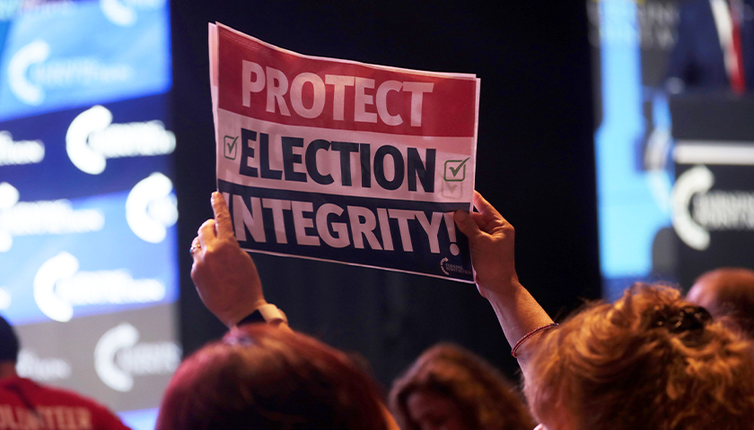 Sign that says "protect election integrity"