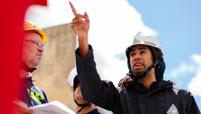 Man in a hard hat pointing his finger