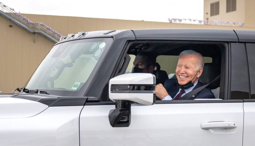 President Biden driving and electric vehicle