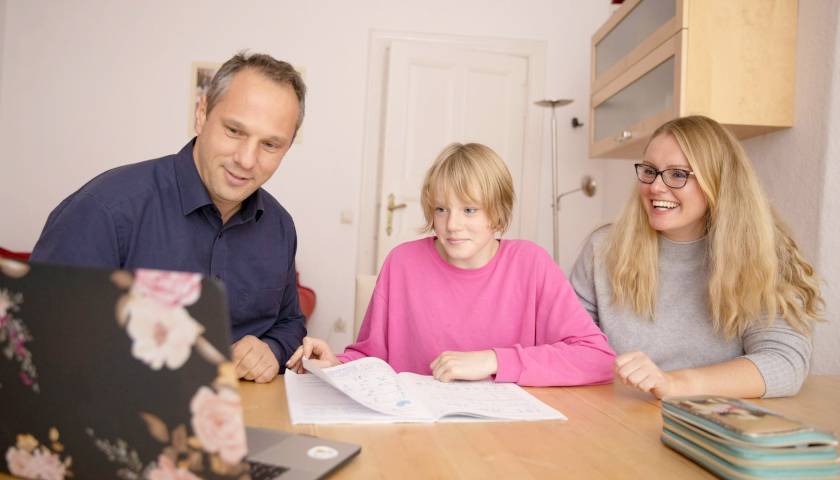 Parents homeschooling their child